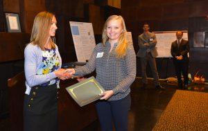RCP Program Assistant Bridget Roby presents the Outstanding Student Project award to Sam Rosner. Photo (c) Steve Schneider 2016.