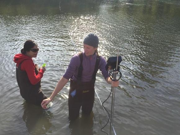 Civil engineering graduate students take measurements in the river. Photo courtesy of Maria Garcia-Serrana.